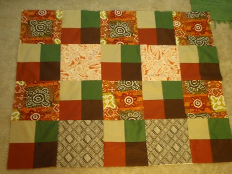 sorry the picture is blurry, but you get the drift.  if it seems the quilt is getting skinnier as it goes up, it is.  stupid math skills. 